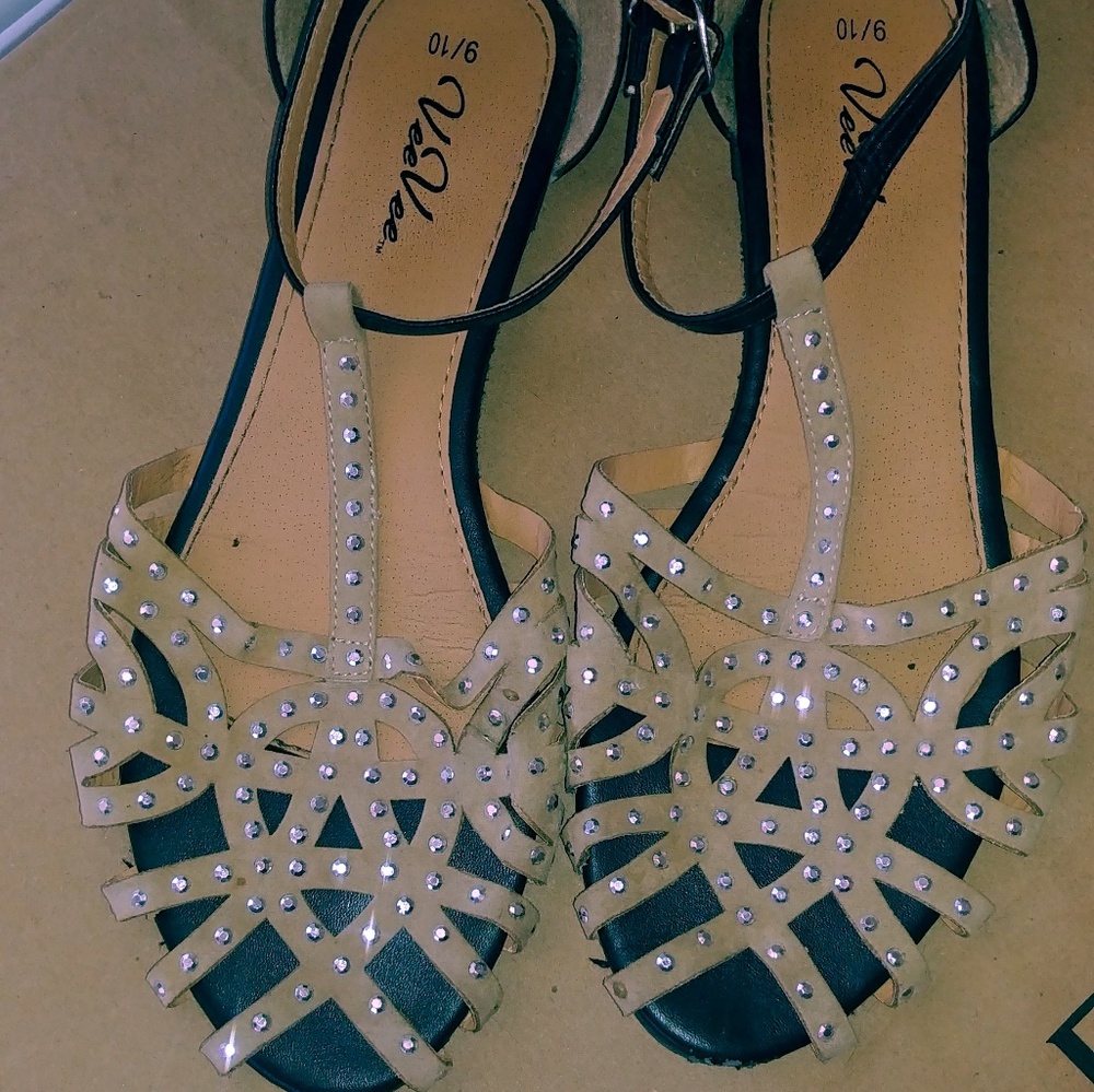 Black and tan buckle flats